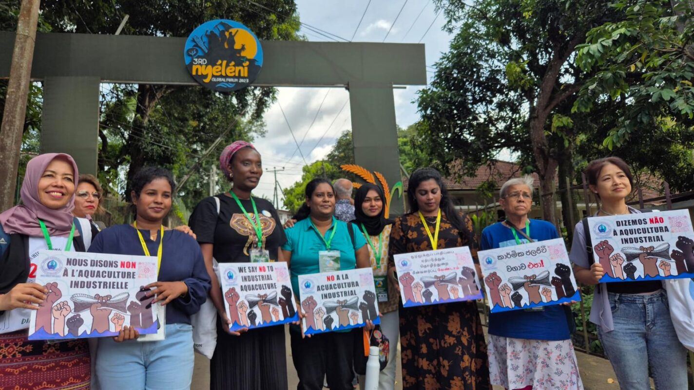 Women from the World Forum of Fisher Peoples (WFFP) stand against industrial aquaculture at the 3rd Nyéléni Global Forum in 2025 in Sri Lanka. Photo courtesy of WFFP.