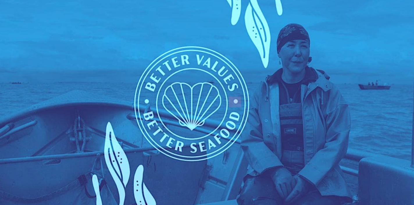 Melanie Brown, commercial and Tribal fisherwoman; SalmonState, World Forum of Fisherpeople, sits in her boat. Ocean and sky can be seen in the background.