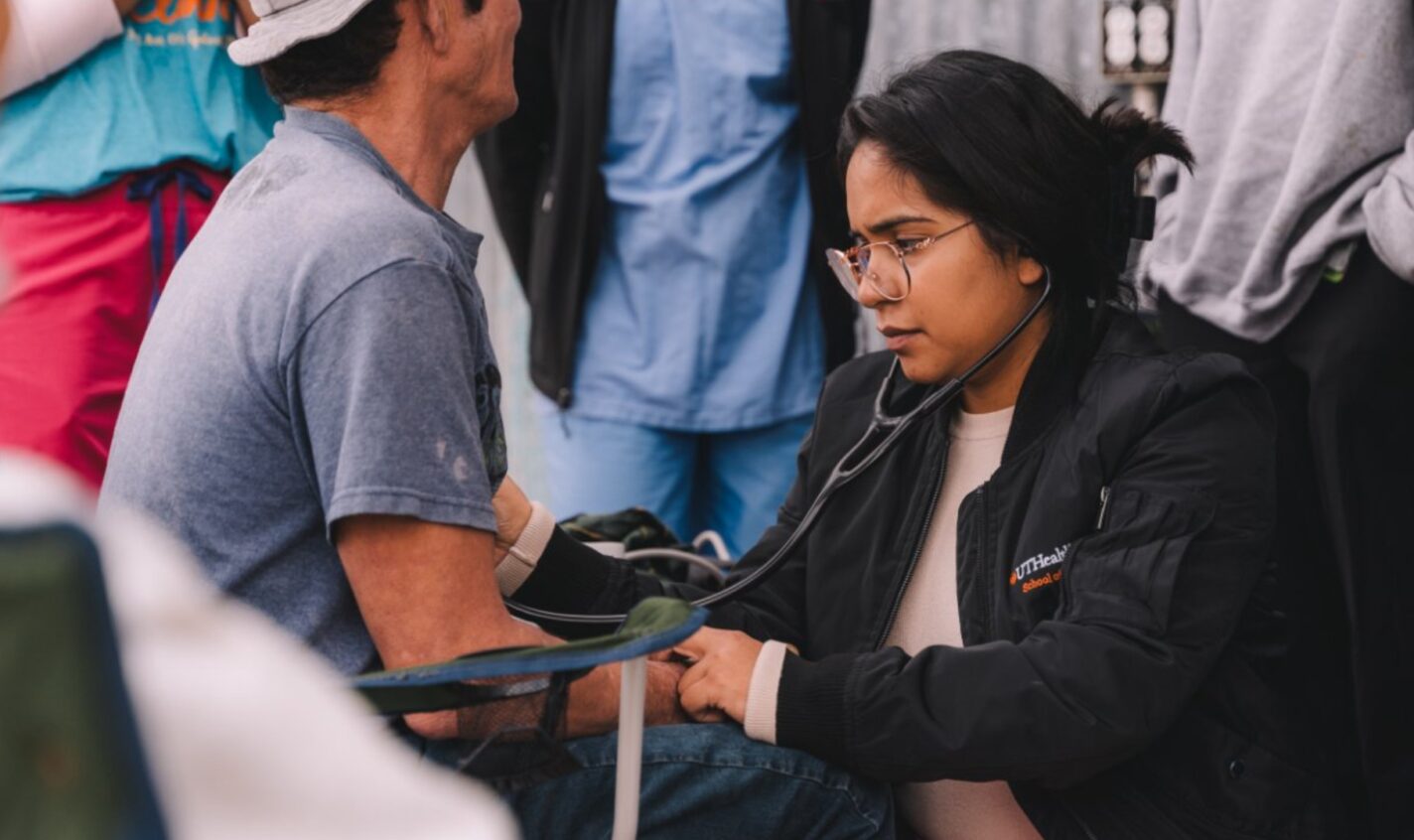 Nurse Martha Díaz checks a shrimper’s vitals at the UTHealth Houston School of Public Health’s Dockside Clinic in Galveston, Texas. (Photo: Joseph Bui)